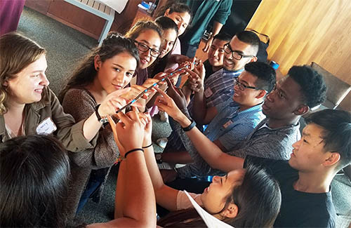 A group of UC San Diego students participates in a communication and leadership workshop