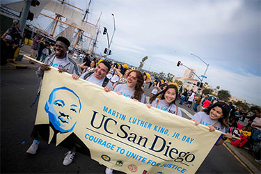 UC San Diego students carry a banner while marching in San Diego's annual Martin Luther King Jr Parade - photo Erik Jepsen