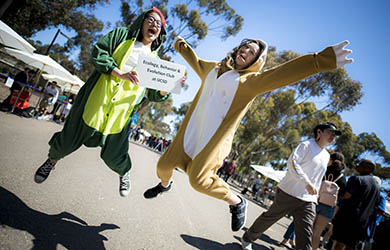 Costumed UC San Diego students jump up in the air - woot woot - photo by Erik Jepsen, UC San Diego Publications